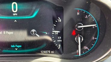 Car dashboard showing 0 MPH and 124075 miles.
