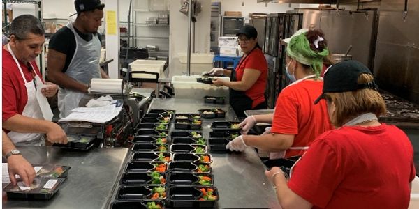 RW Employees packaging Meals on Wheels.