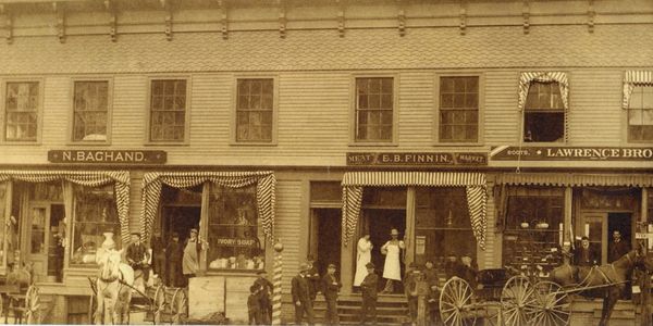 Historical photo of building before it was a Market & Deli.