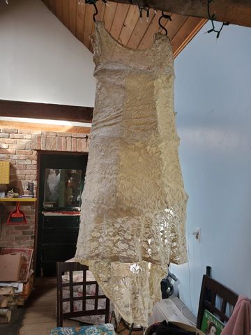 Hanging sculpture. Tomato cage, plaster bandages, lace dress, shetland wool (interior) 2021