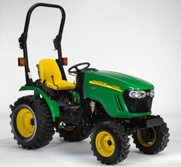 Green and yellow John Deere tractor with large tires.