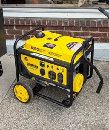Portable Champion 5000 watt generator with wheels.