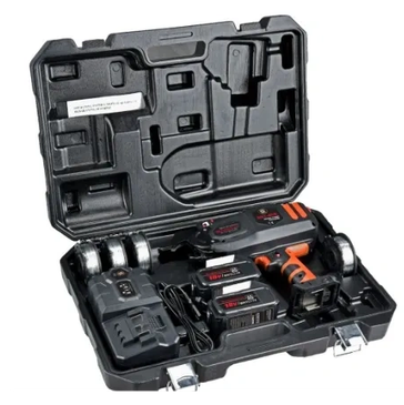 Cordless angle grinder in carrying case with batteries and charger.