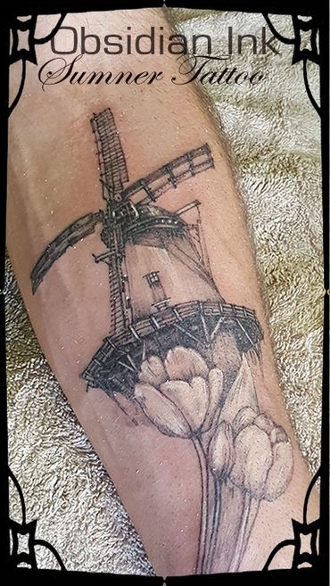 Windmill and tulip tattoo.  Tattoo. Ivar Treskon,
 Obsidian Ink Sumner Tattoo, Christchurch.