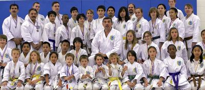 A large group of martial arts students and instructors.