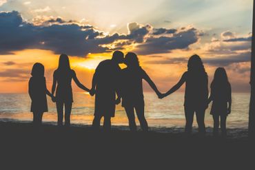 Sunrise family portrait taken by Ocean City Maryland Photographer during the Sunrise 