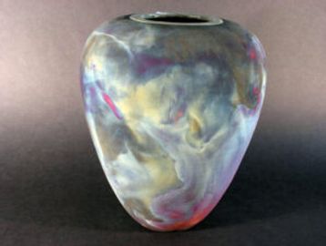 Colorful marbled ceramic vase with a rounded shape and narrow opening.
