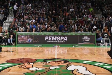 PemSpa Newton advertisement displayed courtside during Boston Celtics game at TD Garden. 