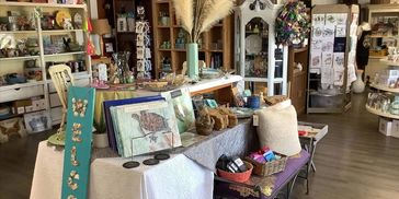 A cozy gift shop with various decorative items on display.
