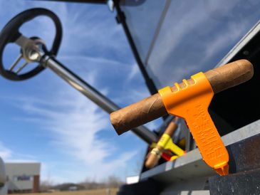 SmokeSpike cigar clip fits in the golf cart's tee bracket