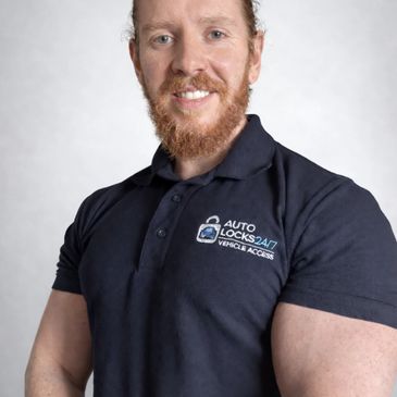 Man in black polo shirt with Auto Locks 24/7 logo.