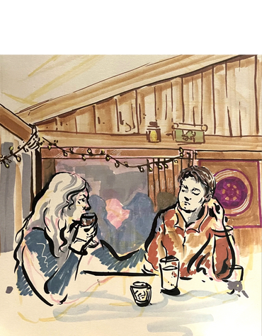A couple sharing drinks in a cozy, warmly lit room with string lights.