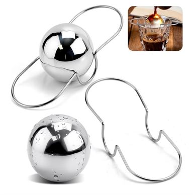 Stainless steel whiskey stones with holder and usage example.