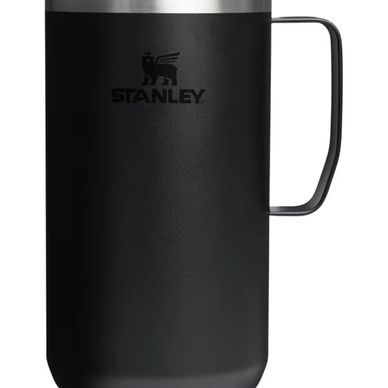 Black Stanley insulated mug with a handle and silver rim.