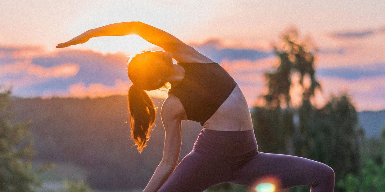 Yoga sunset reveresed warrior practicing girl woman Europe