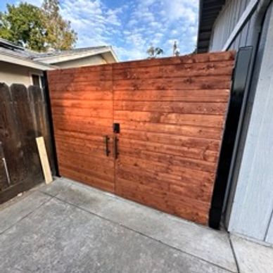 Custom wood and metal fence with touchpad lock. 