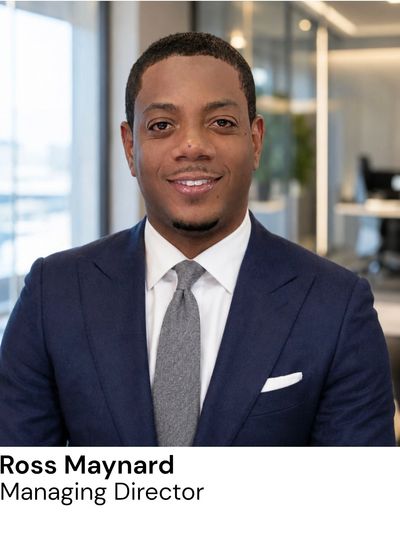 Professional portrait of Ross Maynard, Managing Director, in an office setting.