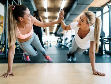 Two women doing push ups