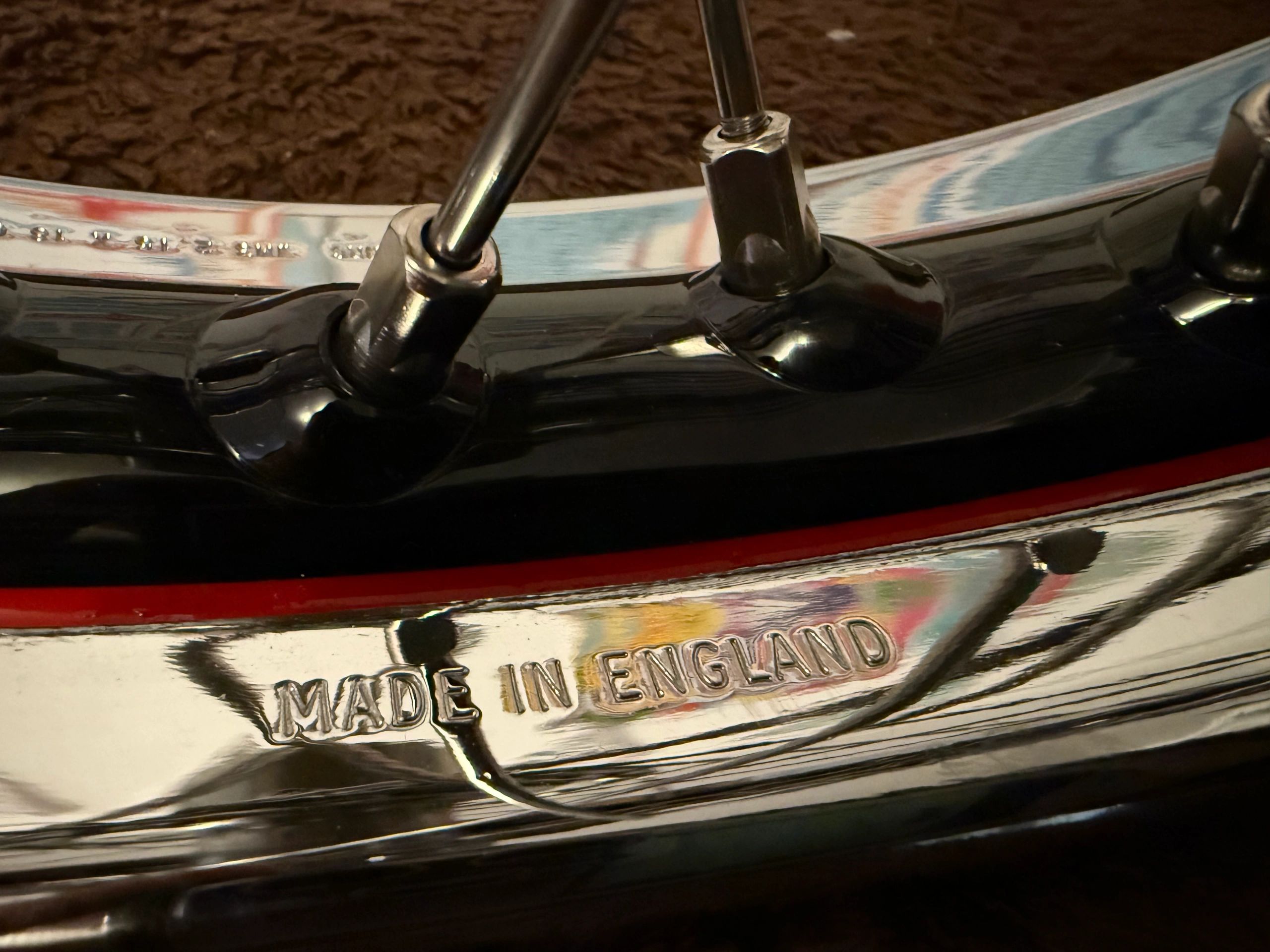 Close-up of a metal object stamped with 'Made in England'.