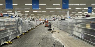 Supermarket aisles covered in plastic during renovation.