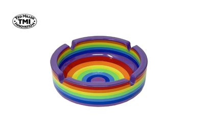 Colorful rainbow-striped glass ashtray with three cigarette rests.