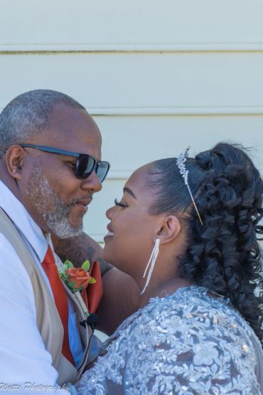 Newlyweds sharing a tender moment.