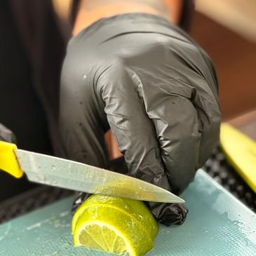 Bartender Only Service, Bartender preparing and cutting the lime garnishes