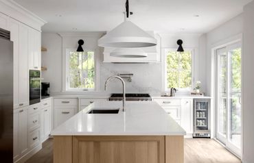 white transitional shaker kitchen white oak island floating shelf shiplap wall custom cabinet hood 