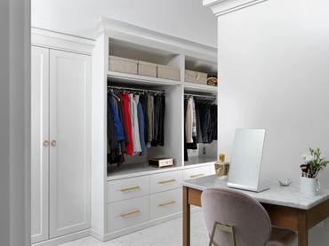 custom closet gold hardware white painted custom cabinets to ceiling