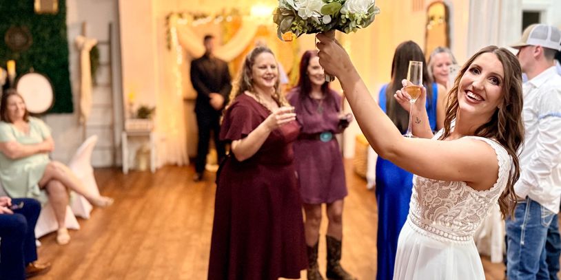 Bride bouquet toss at intimate micro wedding reception in Baton Rouge