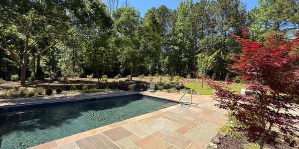 pool project designed by JP Pools for a home near Jefferson GA with premium patio and outdoor area.
