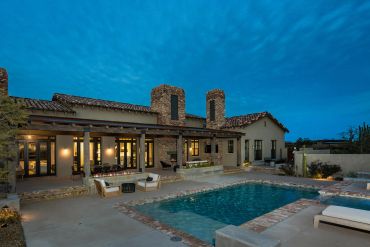 Beautiful house with pool at dusk.