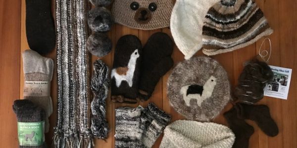 Alpaca wool winter accessories including hats, scarves, and mittens.