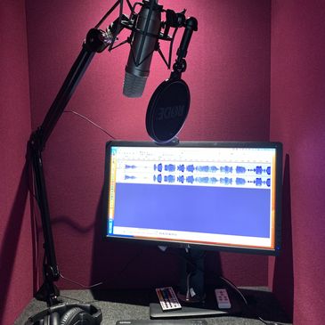 Microphone recording in a professional voice over booth 