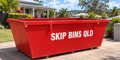 Representative maintained red skip bin on a sunny Brisbane-style driveway.
