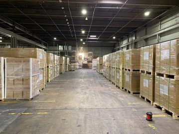 Warehouse stocked with spare solar panels and solar equipment.