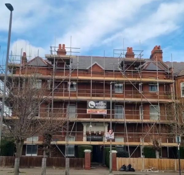 Building under construction with scaffolding.
