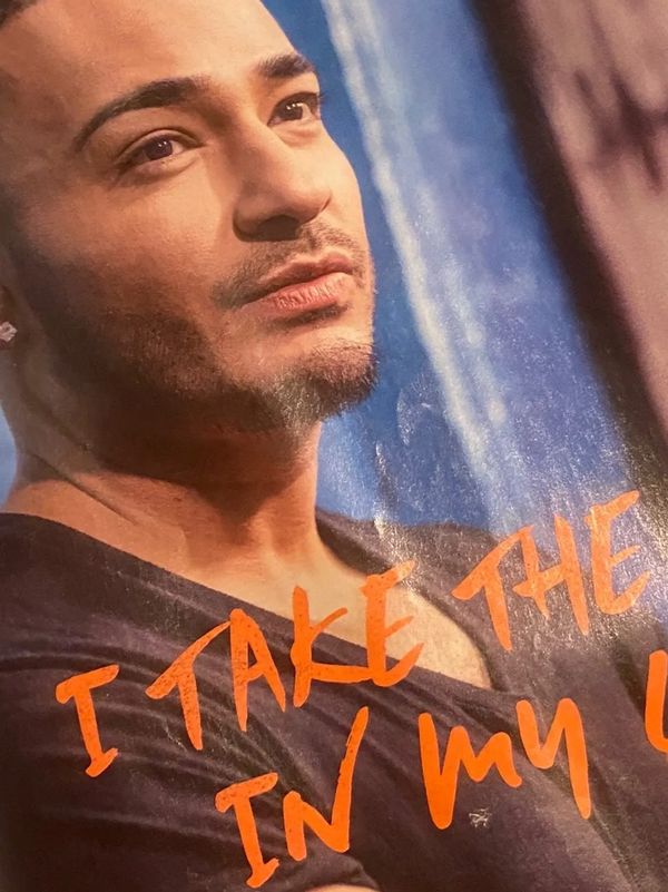 Close-up of a thoughtful man with text overlay in orange.
