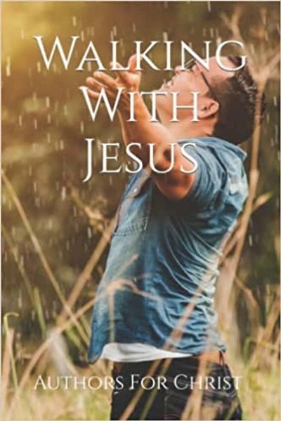 A Christian book cover with a man standing in golden rain worshipping God titled Walking With Jesus. 