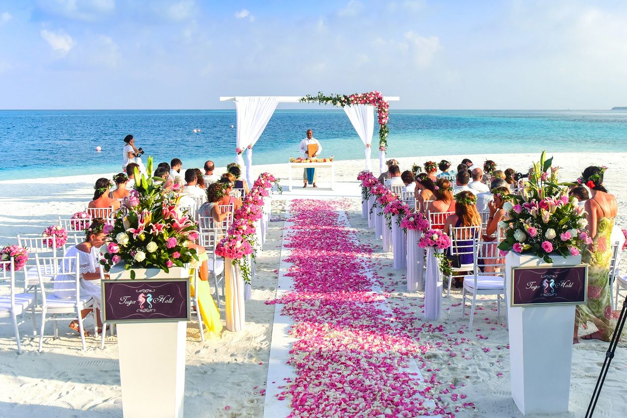 Beach wedding in the Caribbean looking out at the blue waters