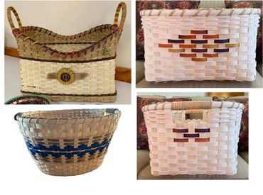 Four woven baskets with varied shapes and decorative patterns.