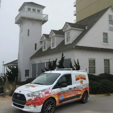 Company wrapped vehicle in front of Virginia Beach Lifesaving Museum.