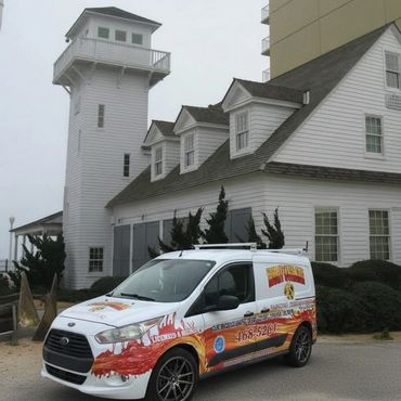Randy Overacre truck in front Virginia Beach Boardwalk. Va Beach Lifesaving museum.