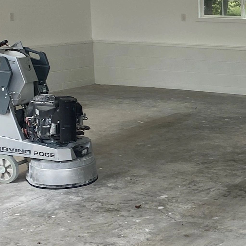 Floor grinding garage floor for prep for Polyaspartic floor coating in Va Beach.