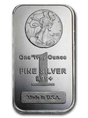 A rectangular silver bar marked one troy ounce of fine silver, made in the USA.