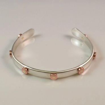 Sterling silver bracelet with copper and brass rivets