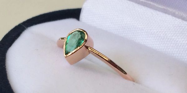Rose gold and emerald engagement ring