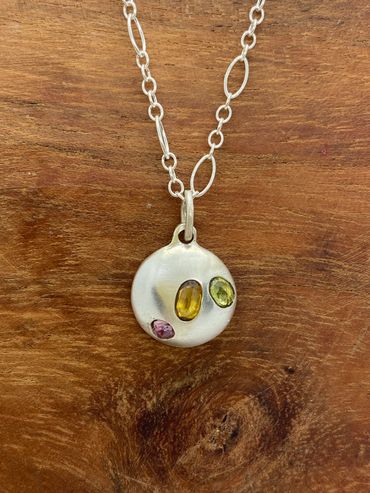 Sterling silver pendant with pink, yellow and green sapphire on a sterling silver chain