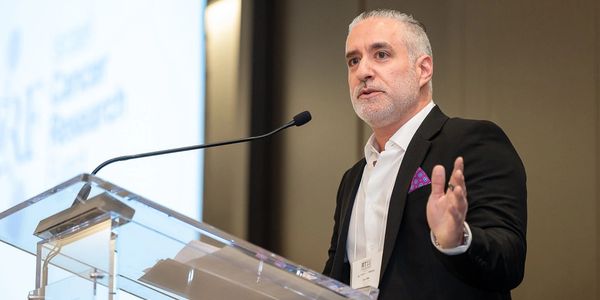 Eric Riz speaking at an event in Toronto 