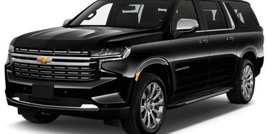 Black Chevrolet Suburban SUV with sleek design and chrome accents.